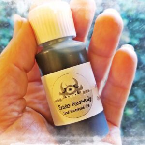 Hand holding bottle with liquid